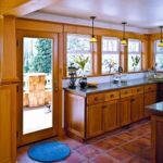 Wood French door and windows brightening a kitchen