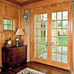 Wood French doors with divided-light glass in a warm-toned room