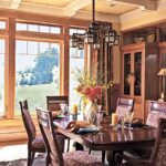 Wood-clad windows in a dining room with warm wood trim