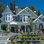 Victorian-style home with bay windows and white trim